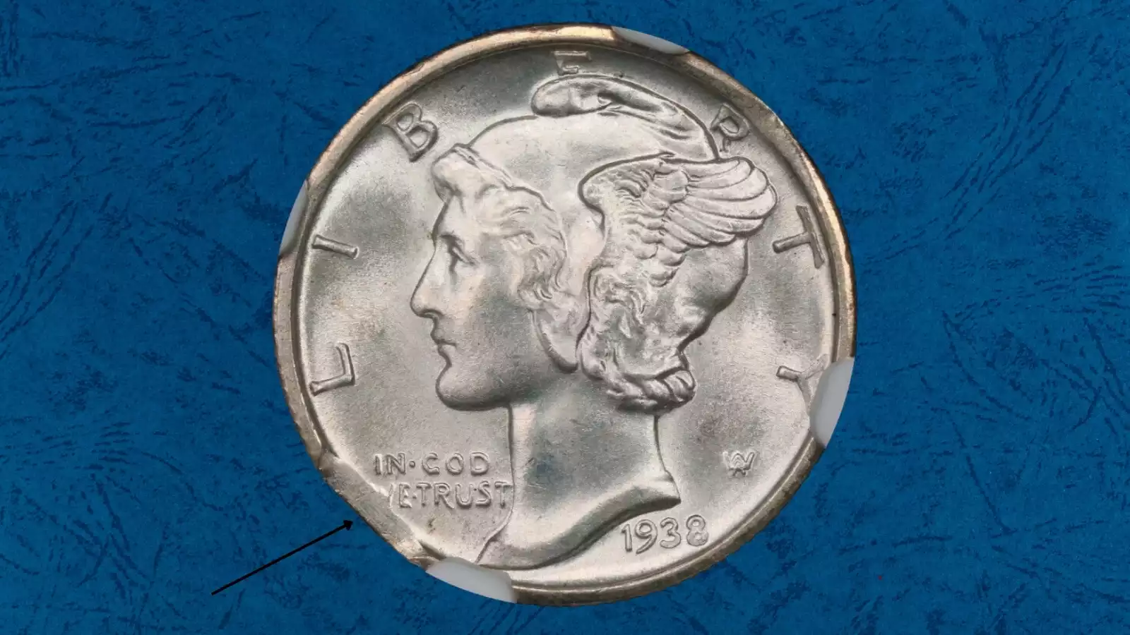 1938 Mercury dime showing curved clipped planchet error with crescent-shaped missing section on the rim and Blakesley Effect opposite
